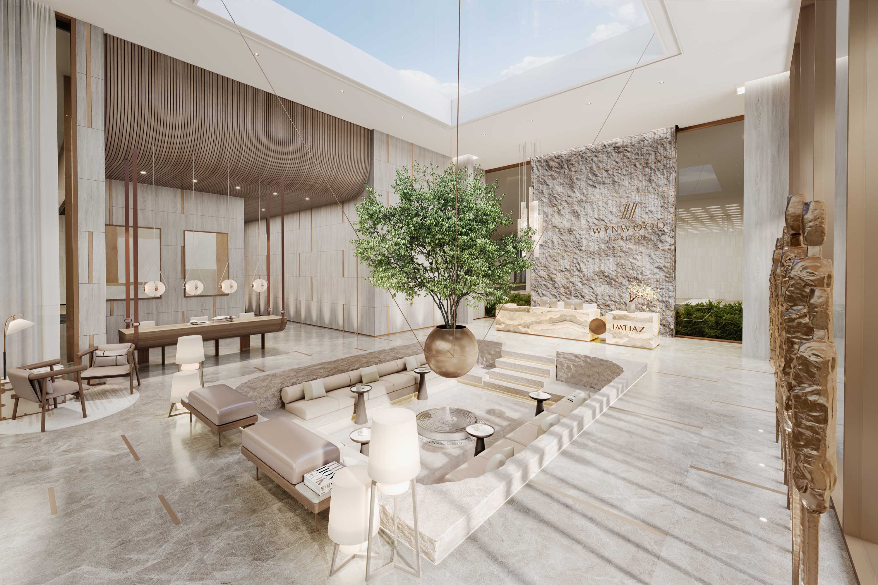 Wynwood Horizon By Imtiaz A spacious, modern lobby with elegant furnishings, natural light, and a prominent plant centerpiece.